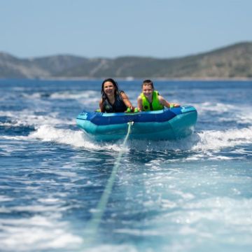The Jobe Sports Kids Neoprene Vest Buoyancy Aid Arranged On A Superyacht Beach Club Platform
